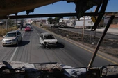 Soldiers keep up clash with cartel gunmen a day after Mexico's military killed top drug lord